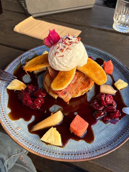 Organic crumpets torched banana, house made coconut maple syrup sour cherries fresh fruits whipped coconut cream