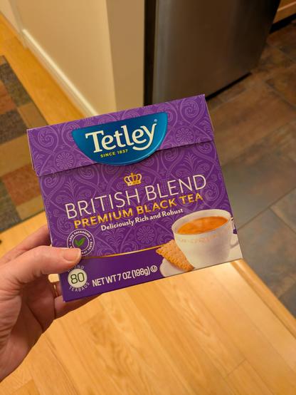It's a purple box of Tetley Tea. British Blend. There's a tea cup and saucer. In no way dows it look like a box of tampons.