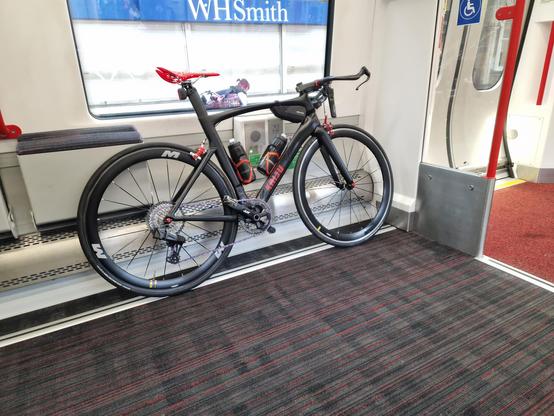 Black & red bike on a train