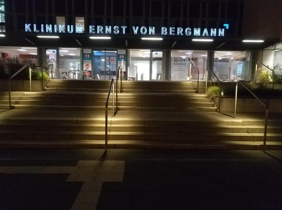 Image of a staircase that is very well lit with an amount of light that fits well with the surroundings.