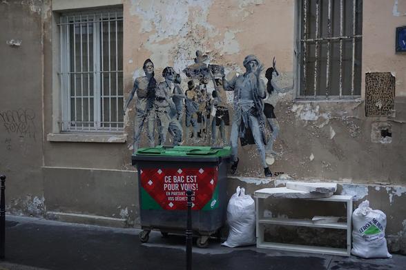 Rubbish, mural and barred windows