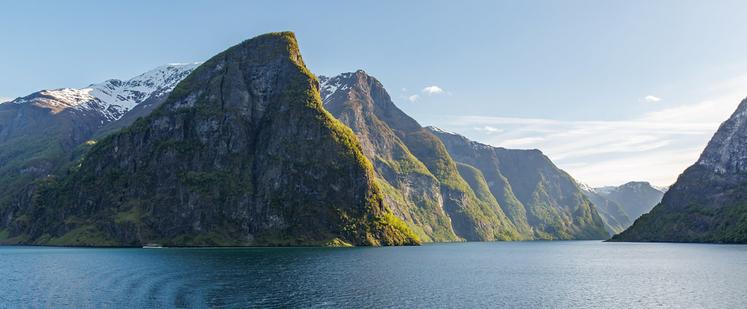 An evening in the Fjords, wonderful light a small electric cruiser for scale and some amazing Norwegian mountains.