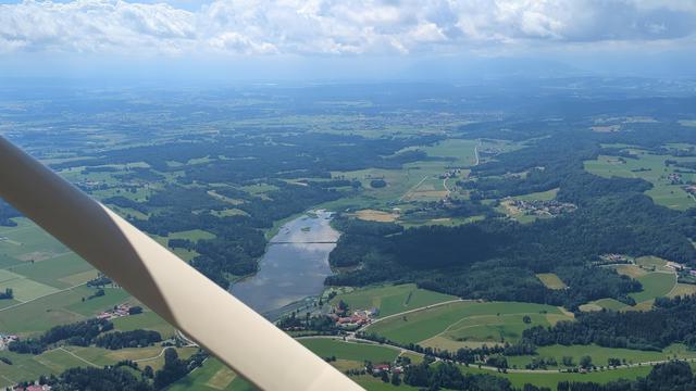 Zellsee, Eibenwald and airfield behind it. Alps in the back.