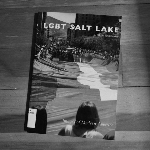 Shows the book lying on a wood floor.