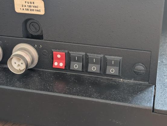 Backside of a "Decision Data" terminal, with 3 ON/OFF switches and a One/Two switch for some unexplicable reason?!