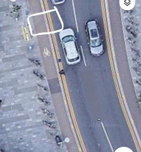 Screenshot of Google maps aerial view of the road where the cycle lane is, and a drawn in white box showing what the car did