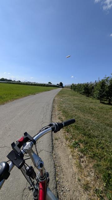 Bike path to #hamradio2025 with zeppelin in front.