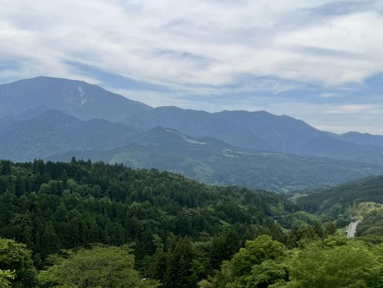 Increasingly deep blue mountains in the distance, seen from a panoramic spot on the Magome-Tsumago Trail.