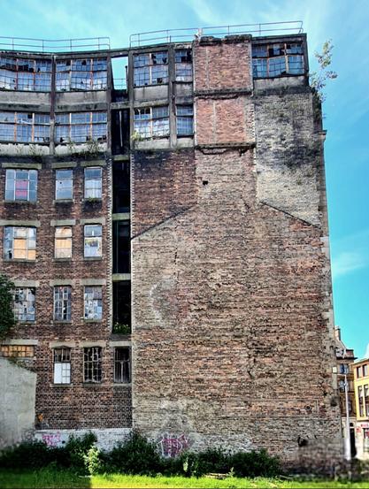 The surviving outline of a demolished buulding on a neighbouring building.