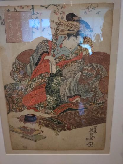 Japanese painting of a young woman in a white kimono. With a musical instrument, some books and holding a bamboo cup in hand