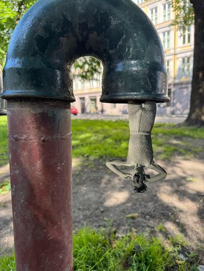 Lady hanging out of a pipe
