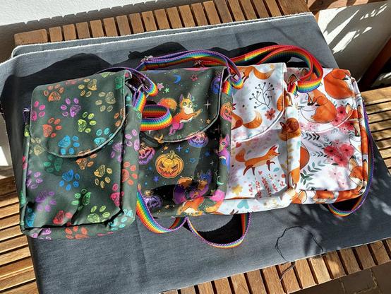 Four different versions of the bag: paw prints, Halloween foxes (or cats), the foxes from the first image and larger more rounded foxes with a really large tail.