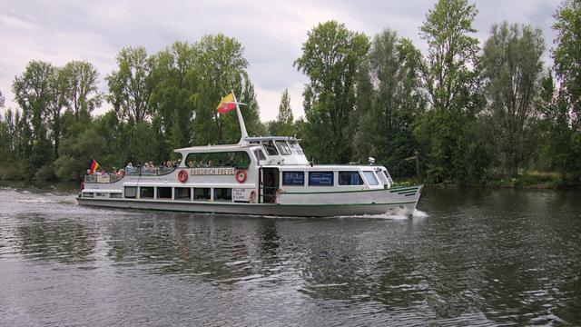 Color Photo of passenger ship Friedrich Freye cruising along the river Ruhr in Mülheim an der Ruhr on an overcast day