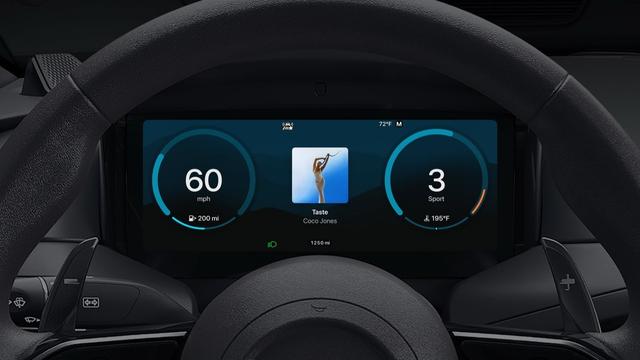 Apples CarPlay Ultra im Cockpit eines Autos, im Vordergrund das Lenkrad. Foto (c) Apple.