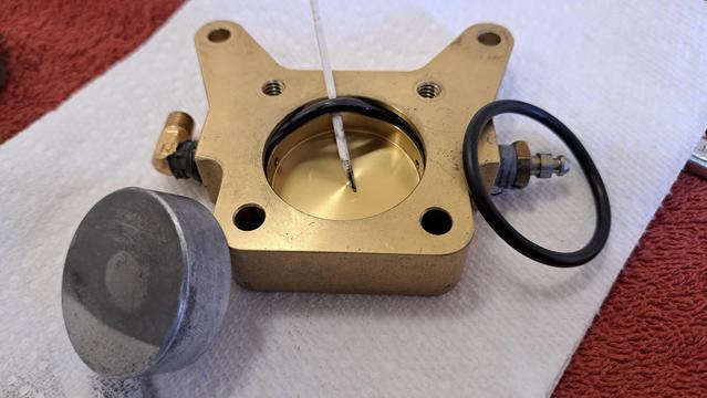 It's easy to remove the old O-ring, but the sides of the aluminum piston rub against the O-ring...and surface quality looks kinda bad. Dirty yes, but I'm gonna hit it with a scotch Brite pad to see if it improves the surface enough.