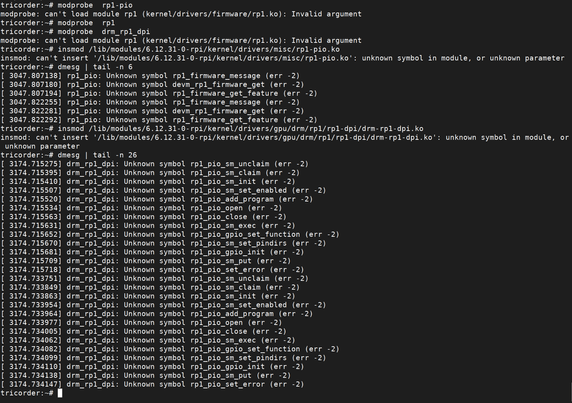 Console screenshot of failing modprobe and insmod commands. The dmesg command shows various unknown symbols.