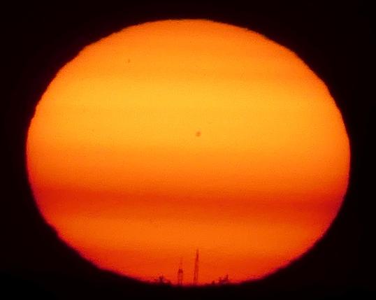 Sun to touch the ground, with two spot groups