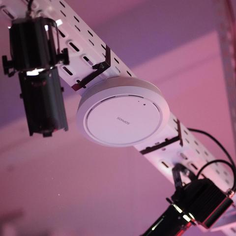 Round white sophos ap mounted on a steel beam with other lamps