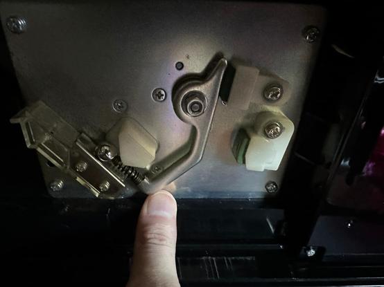 The firing arm moved to touch the ball. Its upper rear portion now touches the top pad.