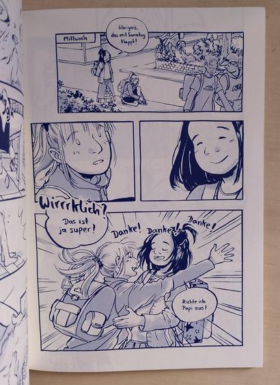 Seite aus dem Comic. Zwei Freundinnen begrüßen sich fröhlich.