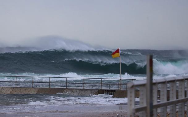 A shot of the big swells and white capped waves at windswept Mereweather beach, Coastal NSW.
Photo taken today by Dave Anderson.