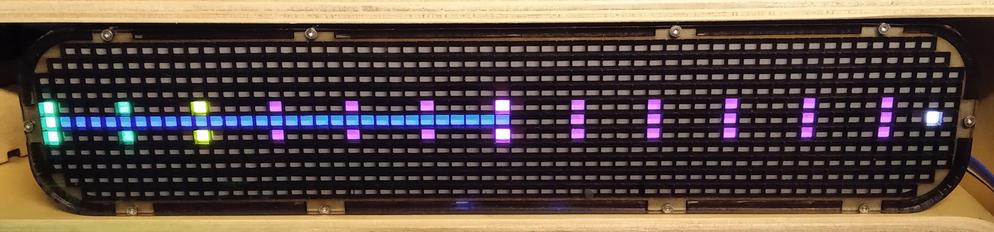 A horizontal 60x11 leds matrix.
Starting on the first colum, centered on the fifth line, 3 leds are lit every 5 colums (so 12 groups of 3, separated by 4 colums).
The first two groups are cyan, the 3rd is yellow, the others are purple.
On the 5th line, from the 2nd colum, 30 leds are lit blue (overriding the middle led of the first 7 3leds groups).