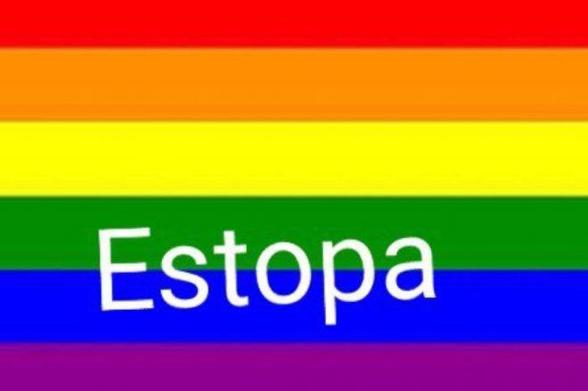 Low quality rainbow pride flag, with a tilted and off centered text saying "Estopa", using the default Arial typeface.