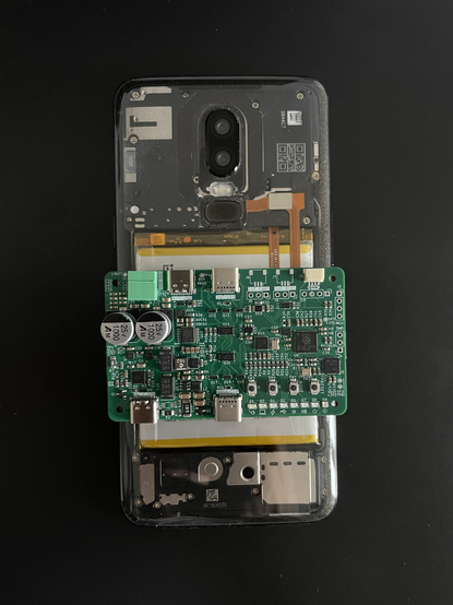 one of the boards on top of a oneplus 6 for scale, it is just slightly wider than the phone