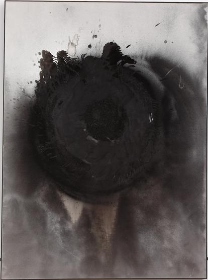 similar, but a grey background with a black and blackened spot, this one is more charred than oily, and there is more smoke residue all over