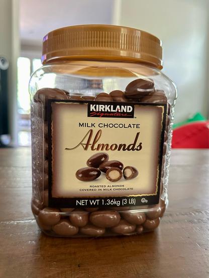 A large 3 pound container of Kirkland milk chocolate almonds