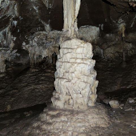 A white stalagmite looking like a molten candle