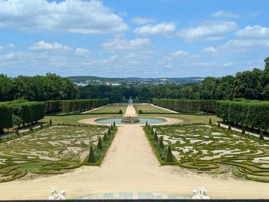 A view of the parterre at the estate of Champs Sur Marne, near Paris, France. June 2025. The restored C17 neoclassical château has pleasing gardens and abuts nearby big forests alongside the River Marne which allow for shaded walks during the present heatwave.