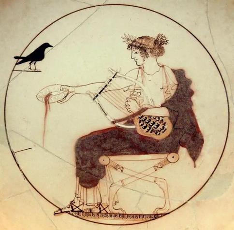 The god Apollo with his raven. Depicted on an ancient Greek kylix (a wide-bowled drinking cup with handles).