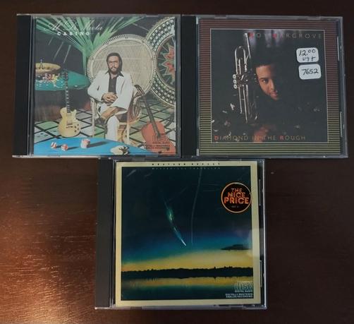 A photo of 3 CDs

Top Left: Al Di Meola - Casino

Top Right: Roy Hargrove - Diamond in the Rough

Bottom: Weather Report - Mysterious Traveller