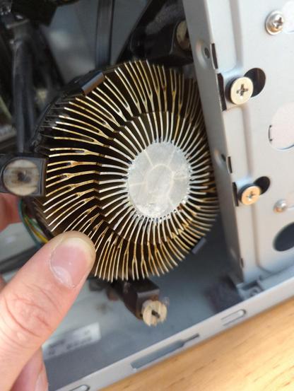 A rather filthy intel CPU cooler found loosely in a case