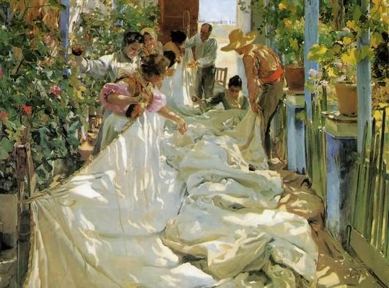 a group of women and men are in the dappled shade, mending a huge white sail for a ship. It is airy and light and bright and they are surrounded by flowers and pots of plants
