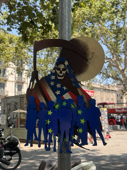 A grim reaper draped in a U.S. flag wreaks havoc on the EU and the world.