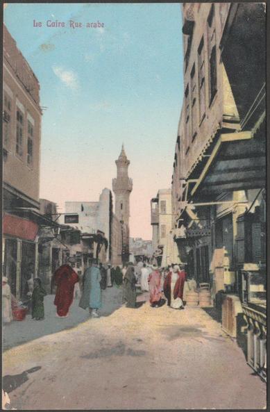 Printed colour postcard showing a view of the Rue Arabe in Cairo, Egypt.

Published by Lichtenstern & Harrari, Cairo, No 48, c.1905-10.

Postally unused.

Fairly good condition, with very slight corner bumps and medium album marks, but some chipping to bottom left corner.