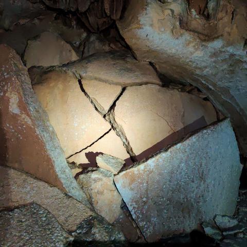 Layers of concretion that built up in an spherical shape and then broke apart and burst open, looking like layers of eggshells