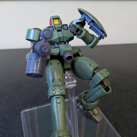 HGAC Leo jumping back while pointing a gun at the viewer