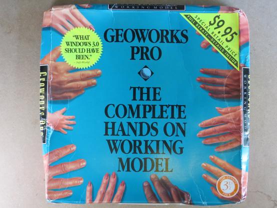 The big box cover for GeoWorks Pro: The Complete Hands on Working Model. It shows human hands around the edges of the box, reaching toward the center.

A sticker reads: "What Windows 3.0 Should Have Been"