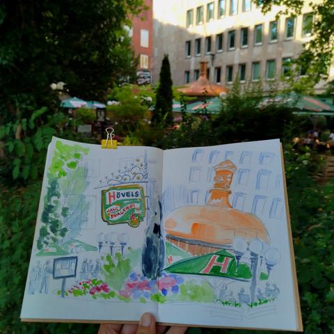 Sketchbook in front of the scenery.