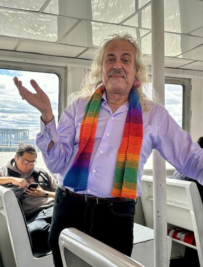 Me posing after performing the ceremony like a pro. Lavender shirt with cuff links, black jeans. The (rainbow) scarf was for warmth, a dear friend knit it for me!