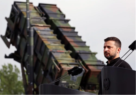 Ukrainian President Volodymyr Zelensky stands in front of a Patriot anti-aircraft missile system during his visit to a military training area in Germany, 11 June 2024. Credit: EPA-EFE/JENS BUETTNER