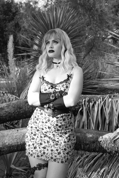 Black and white portrait of a woman looking off in the distance. https://www.Instagram.com/GothiccRoze