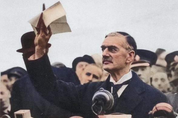 Neville Chamberlain waving his piece of paper in the air.