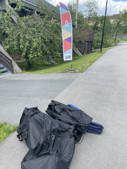 3 SUP and 3 vests are piled up in the side of the road by the BUA office.