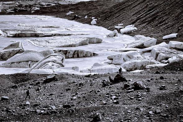 a enormous basin of what could be normally be called frozen spilled milk, but look for my friend running in the lower left corner of the barren foreground and then imagine the sheer size of this entire region