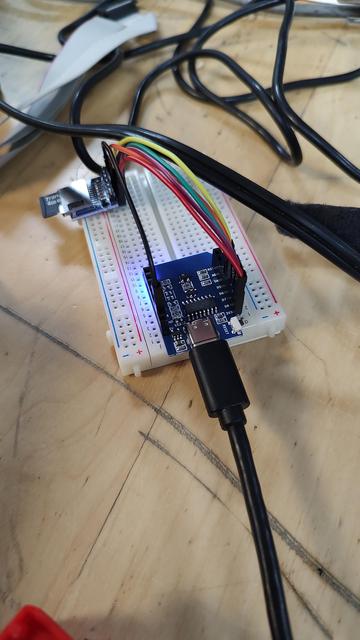 An EPS328266 board on a breadboard, with a microSD slot near it
