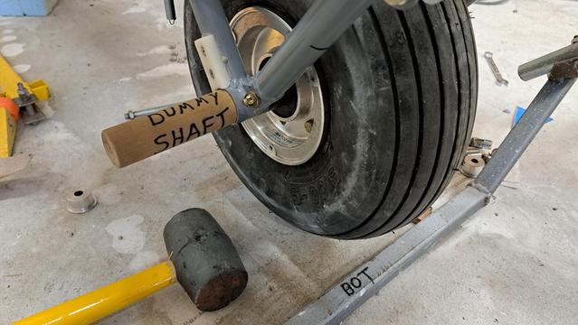 A thick wooden dowel serves as a dummy shaft to set up alignment of some parts...and is then easily pushed out when the steel tubular shaft is inserted. All the parts happily remain in place during this assembly step.
